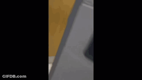 Man In Black Jumpsuit At Sink GIF
