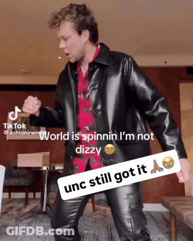 Man In Black Leather Jacket Dancing World Is Spinnin I'm Not Dizzy GIF