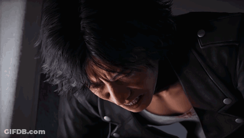 Man In Black Leather Jacket Looking Down GIF