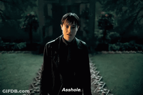 Man In Black Leather Jacket Talking In Front Of House GIF