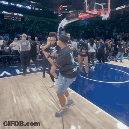Man In Black Lynx Shirt On Basketball Court GIF