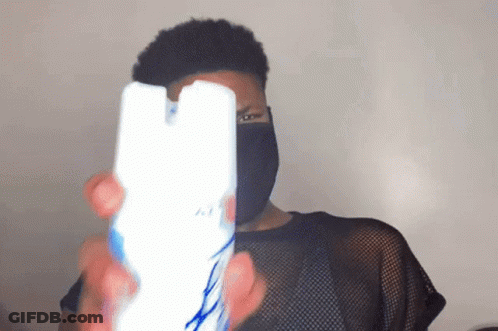 Man In Black Mask Holding Air Freshener GIF