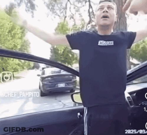 Man In Black McCain Shirt Arms Outstretched GIF