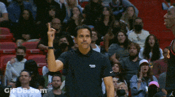 Man In Black Miami Shirt Before Crowd GIF