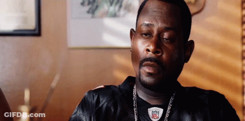 Man In Black NFL Jersey Sitting In Chair GIF