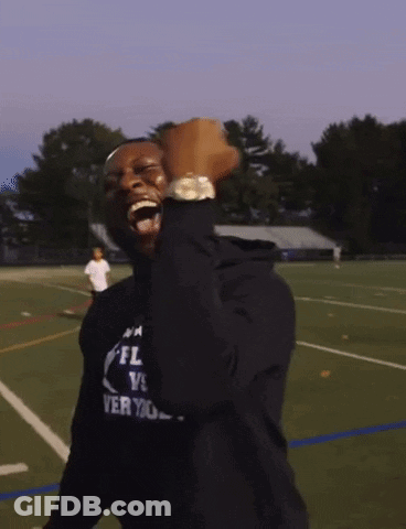 Man In Black NFL Shirt Fist Pump GIF