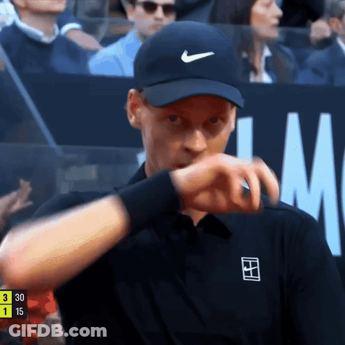 Man In Black Nike Hat Checking Watch GIF