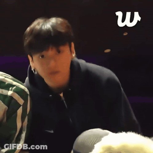 Man In Black Nike Hoodie Stands In Front Of Another Man GIF