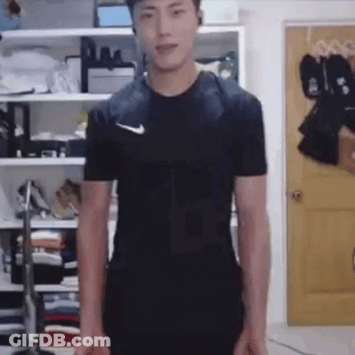 Man In Black Nike Shirt Standing GIF