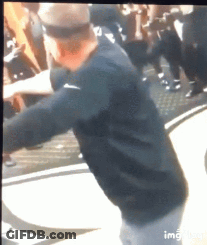 Man In Black Nike Shirt Standing Before Crowd GIF