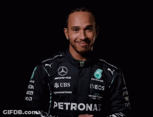 Man In Black Petronas Jacket Smiling GIF
