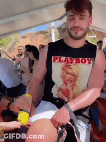 Man In Black Playboy Tank Top Holding Yellow Bottle GIF