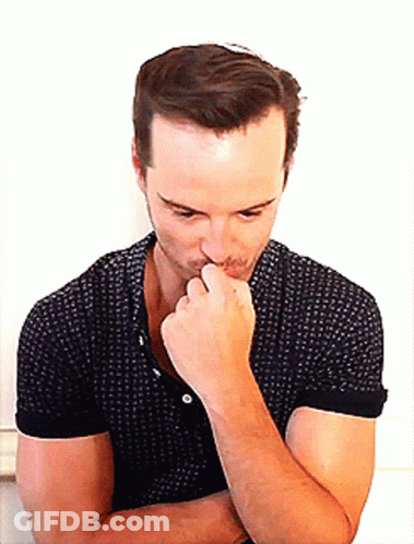 Man In Black Polka Dot Shirt Holding Hand To Chin GIF