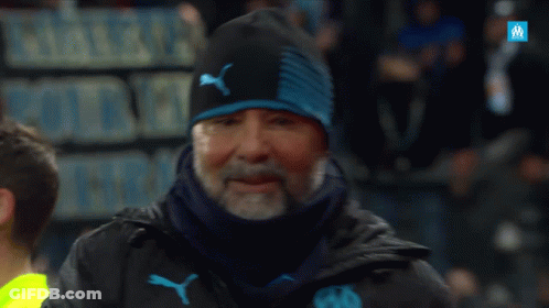 Man In Black Puma Jacket In Front Of Sign Pierre Pour Les Trais GIF