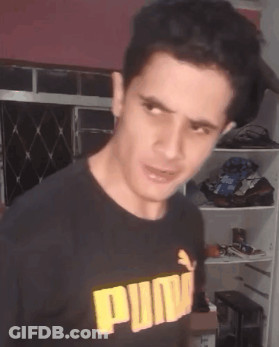 Man In Black Puma Shirt Making Face GIF