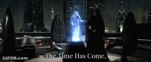 Man In Black Robe Before Glowing Figure GIF