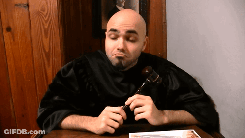 Man In Black Robe Holding Gavel GIF