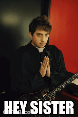 Man In Black Robe Holding Guitar Hey Sister GIF