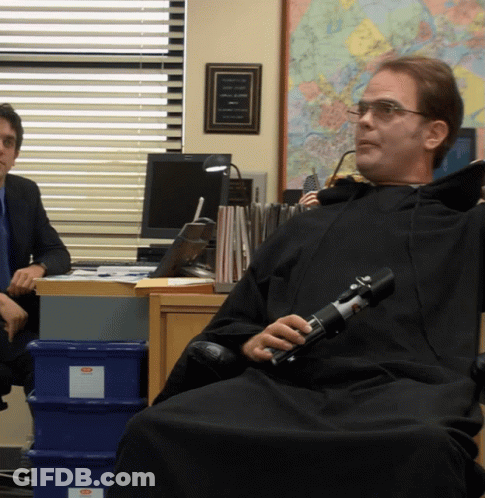 Man In Black Robe Holding Light Saber GIF