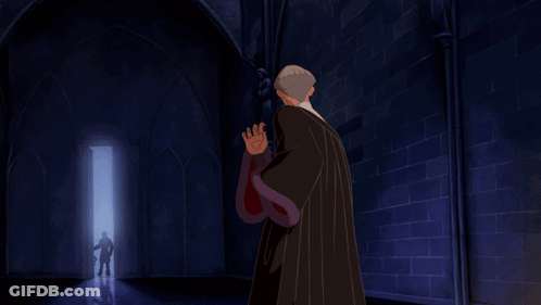 Man In Black Robe Holding Purple Star Object GIF