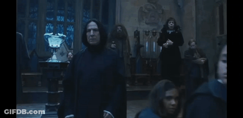 Man In Black Robe In Dark Room GIF