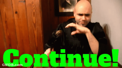 Man In Black Robe Sitting In Front Of Continue Sign GIF
