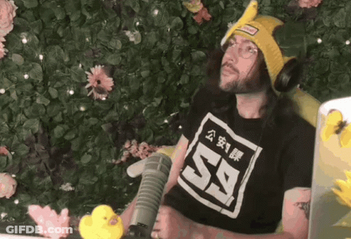 Man In Black Shirt 59 At Microphone GIF
