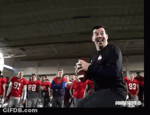 Man In Black Shirt 93 Dancing In Front Of Football Players GIF