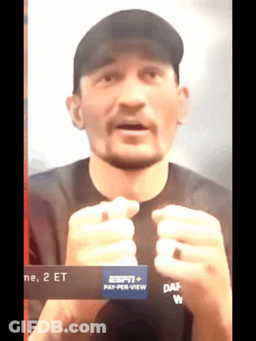 Man In Black Shirt And Black Hat Saying Pay Per View GIF