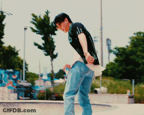 Man In Black Shirt And Blue Jeans In Front Of Pepsi Sign GIF