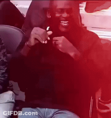 Man In Black Shirt And Blue Jeans Smiling GIF