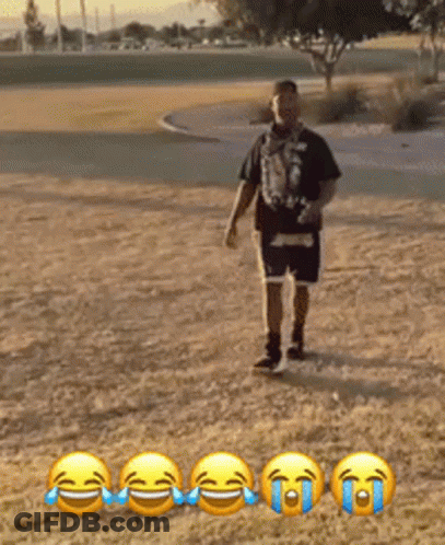Man In Black Shirt And Blue Shorts In Field Of Smileys GIF