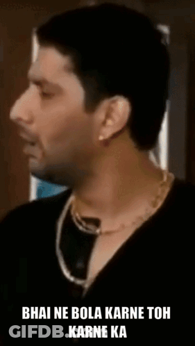 Man In Black Shirt And Gold Chain Talking GIF