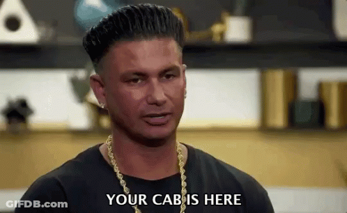Man In Black Shirt And Gold Chains Saying Your Cab Is Here GIF