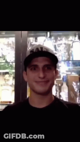 Man In Black Shirt And Hat With Letter T GIF