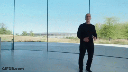 Man In Black Shirt And Pants Standing Before Glass Wall GIF