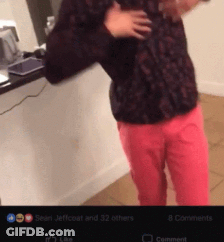 Man In Black Shirt And Pink Pants With Like Button GIF
