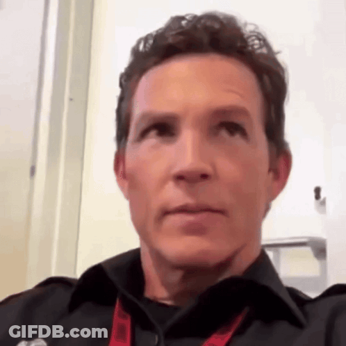 Man In Black Shirt And Red Lanyard GIF