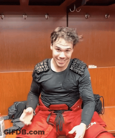 Man In Black Shirt And Red Pants Sitting GIF