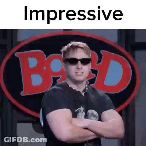 Man In Black Shirt And Sunglasses Arms Crossed At Billboard GIF