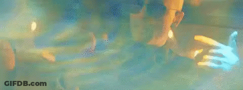 Man In Black Shirt And Sunglasses Before Woman GIF