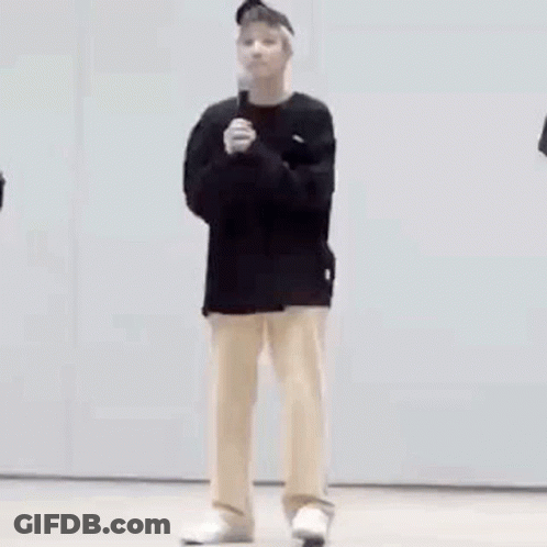 Man In Black Shirt And Tan Pants GIF