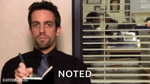 Man In Black Shirt And Tie Holding Pen And Notebook GIF