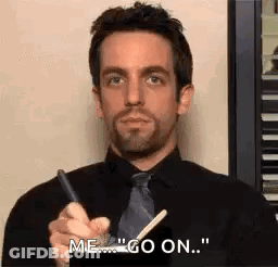 Man In Black Shirt And Tie Saying Me Go On GIF