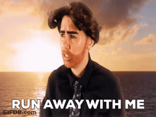Man In Black Shirt And Tie Saying Run Away GIF