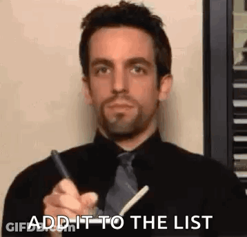 Man In Black Shirt And Tie Writing On Paper GIF