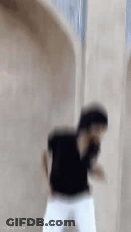 Man In Black Shirt And White Pants Dancing GIF