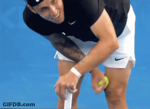 Man In Black Shirt And White Shorts Holding Tennis Racquet GIF