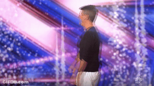 Man In Black Shirt And White Shorts On Stage GIF