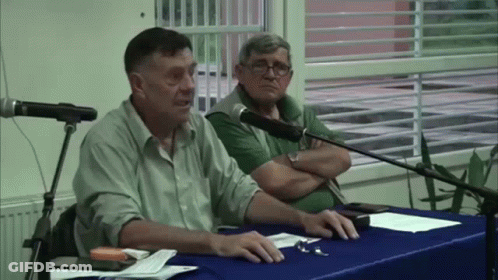 Man In Black Shirt And Woman In Pink Costume GIF